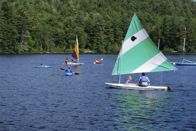 Campers go boating and kayaking at Forest Lake Camp in Warrensburg, N.Y., during a previous season. 