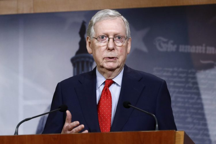 Senate Majority Leader Mitch McConnell of Ky., speaks with reporters April 21 after the Senate approved a nearly $500 billion coronavirus aid bill on Capitol Hill in Washington. 