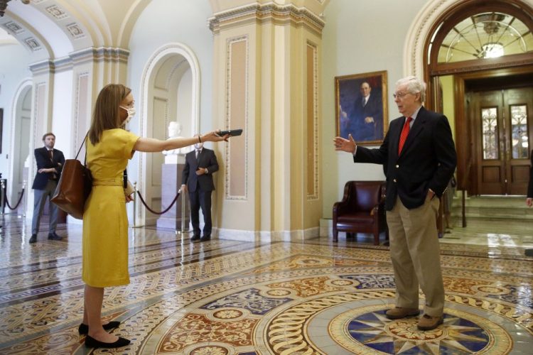 Senate Majority Leader Mitch McConnell of Kentucky speaks with a reporter outside the Senate chamber on Capitol Hill in Washington on Thursday. 