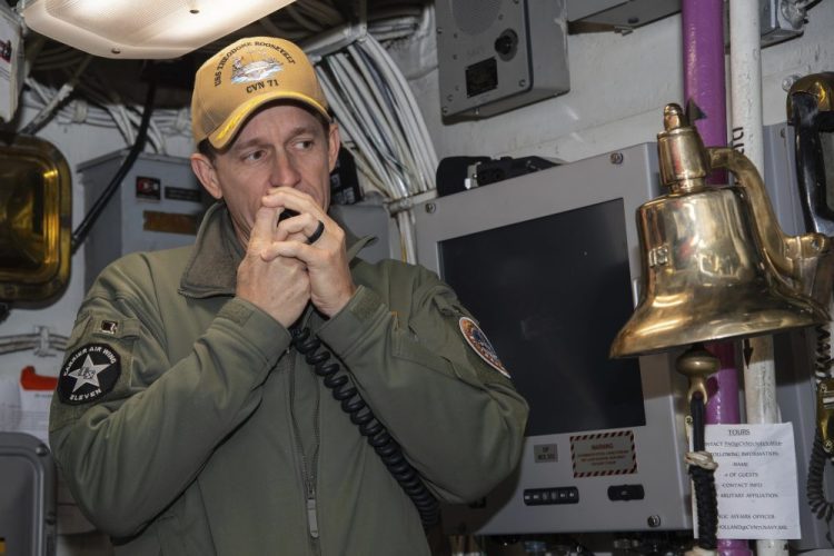 Capt. Brett Crozier, then-commanding officer of the aircraft carrier USS Theodore Roosevelt (CVN 71), addresses the crew in January. The Navy’s top admiral will soon decide the fate of the ship captain who was fired after pleading for his superiors to move faster to safeguard his coronavirus-infected crew. 