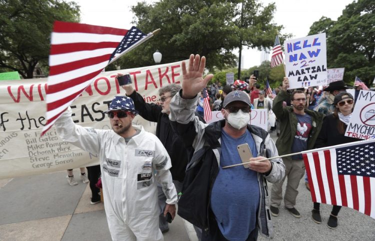 Protesters rally at the Texas State Capitol to speak out against Texas' handling of the COVID-19 outbreak, in Austin on Saturday. Austin and many other Texas cities remain under stay-at-home orders due to the COVID-19 outbreak. 