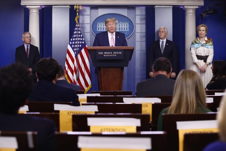 President Trump speaks during a coronavirus task force briefing at the White House on Saturday in Washington. From left, Dr. Anthony Fauci, director of the National Institute of Allergy and Infectious Diseases, Trump, Vice President Mike Pence and Dr. Deborah Birx, White House coronavirus response coordinator.