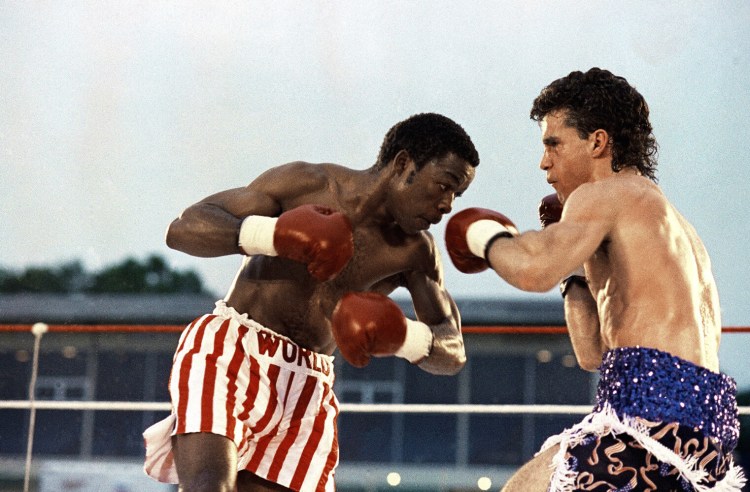 Jerry NGobeni, left, of South Africa, and Joey Gamache, of Lewiston, trade punches during the WBA Junior Lightweight Championship title fight, Friday, June 28, 199 in, Lewiston. Gamache, 25, won after knocking NGobeni down twice in the 10th round. 

