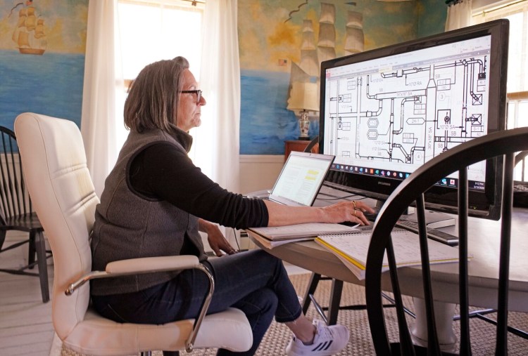 Kate Everett, director of operations for SMRT, works from her home office in Kennebunk on May 13. Many working remotely in Maine are enjoying their time at home, and some employers say staff are more engaged and productive.