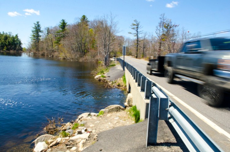 The bridge and the informal hand-carry boat launch, top center, into Lower Togus Pond, seen May 13, 2020 on the south side of Route 105 in Augusta. The shoulder of road on both sides of bridge between the ponds is a popular spot to park vehicles to fish or launch boats.