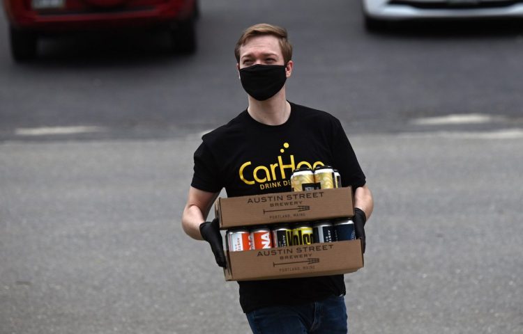 Thomas Brems of CarHop makes a beer delivery in 2020. 