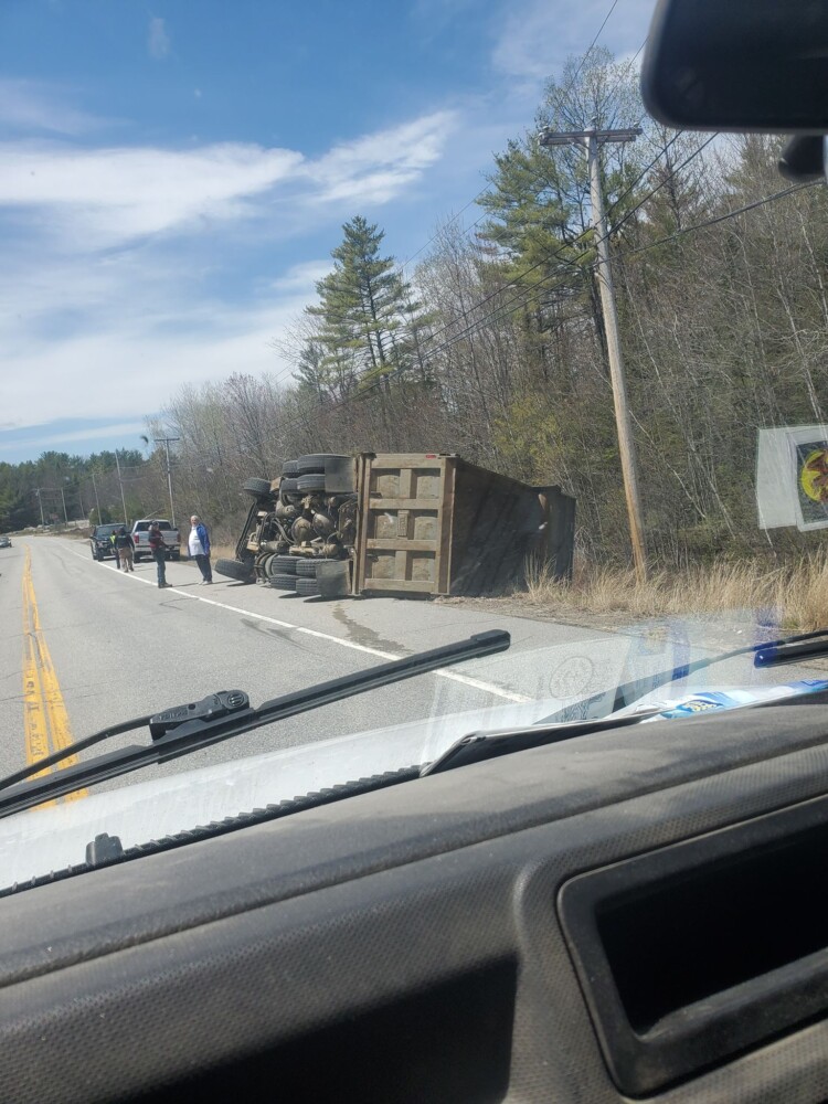 Dump truck flips over in Harrison