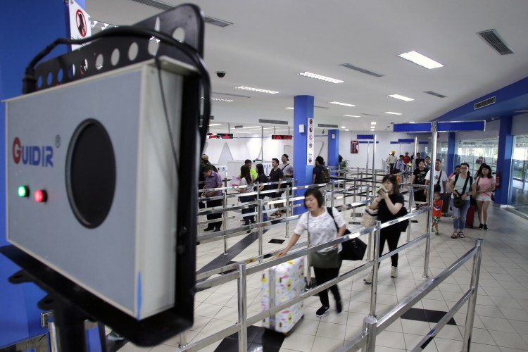 A thermal scanner is installed to scan the body temperature of passengers arriving in Batam, Indonesia, in 2016 as officials tried to detect passengers infected with the Zika virus.  Some small businesses and public officials are now spending heavily on the cameras without understanding their limitations – namely, that they're not very good at actually detecting coronavirus infections.