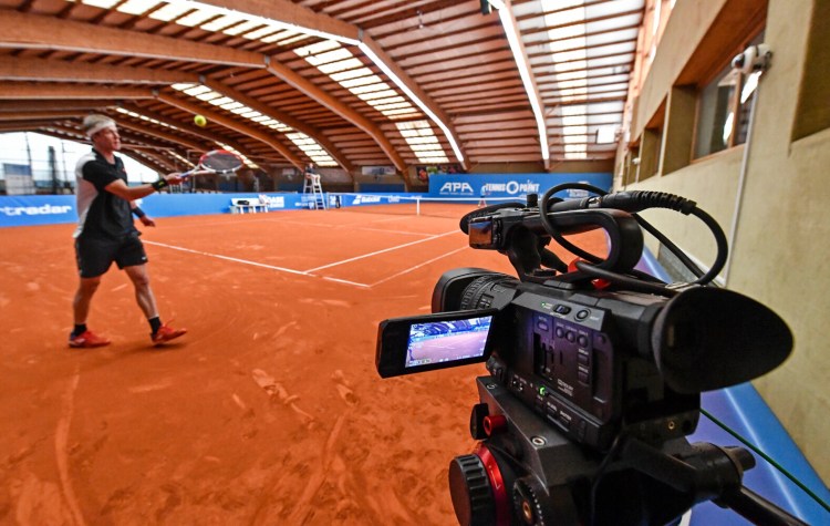 A camera is filming a match during a pro-tennis tournament at a tennis academy in Hoehr-Grenzhausen, western Germany on Friday. The professional tennis exhibition in the small village in the Westerwald is a rare exception to the global shutdown of sports during the coronavirus pandemic. 