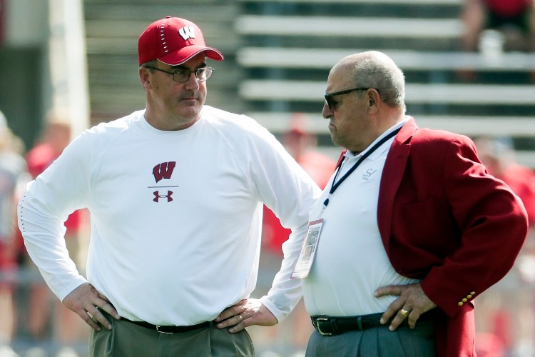 Wisconsin football coach Paul Chryst, left, and Athletic Director Barry Alvarez were among 25 employees at the school asked to take a 15% pay cut over the next six months.
