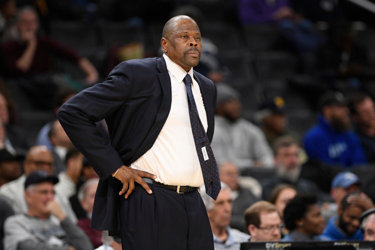 Georgetown Coach Patrick Ewing, who announced Friday he was in the hospital after testing positive for COVID-19, is home and recovering, according to his son. 