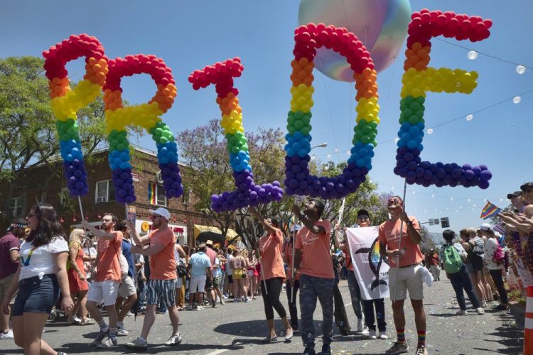 Participants in the 49th annual Los Angeles Pride Parade June 9, 2019, in West Hollywood, Calif. Organizers have canceled the 2020 edition of LA Pride, one of California's largest gay and lesbian rights festivals, amid the coronavirus pandemic. The 50th annual LA Pride Parade and Festival will be held digitally this year.
