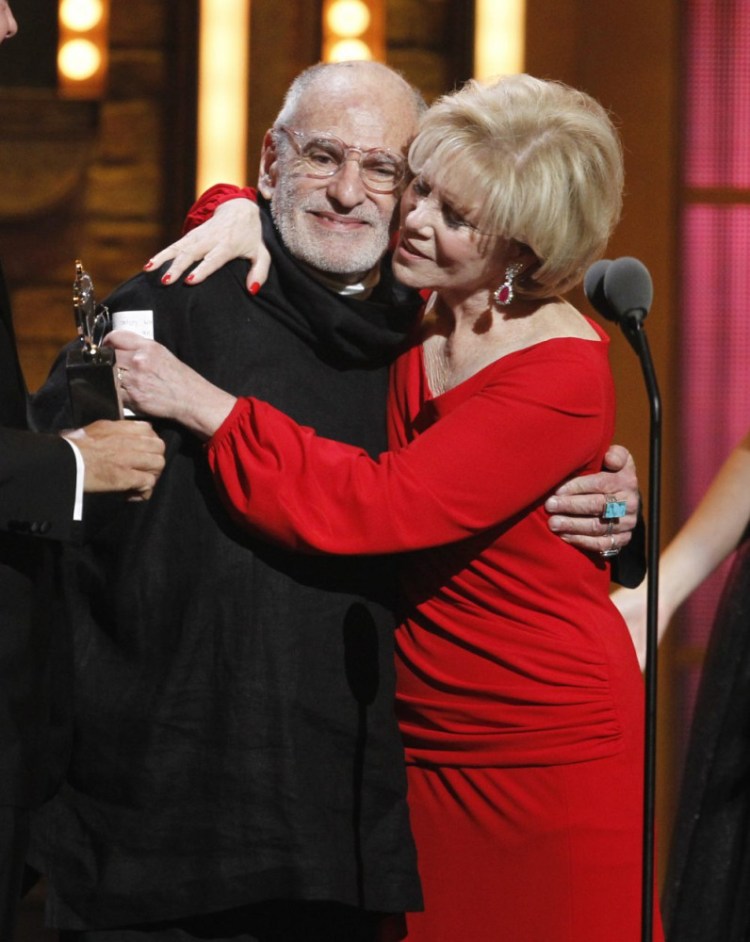 Larry Kramer and Daryl Roth embrace after they won the Tony Award for Best Revival of a Play for "The Normal Heart" during the Tony Awards in New York in 2011. 