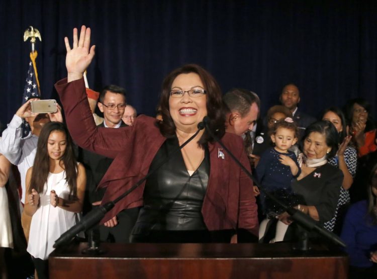 In this Nov. 8, 2016 file photo, Sen.-elect Tammy Duckworth, D-Ill., celebrates her win over incumbent Sen. Mark Kirk, R-Ill., during her election night party n Chicago.  The PBS documentary series “Asian Americans” that airs next week is a sweeping look at their impact on society, politics and pop culture between the mid-19th century and 9/11.   The show features reflections from people like Duckworth. It's co-narrated by “Hawaii Five-0” actor Daniel Dae Kim. 