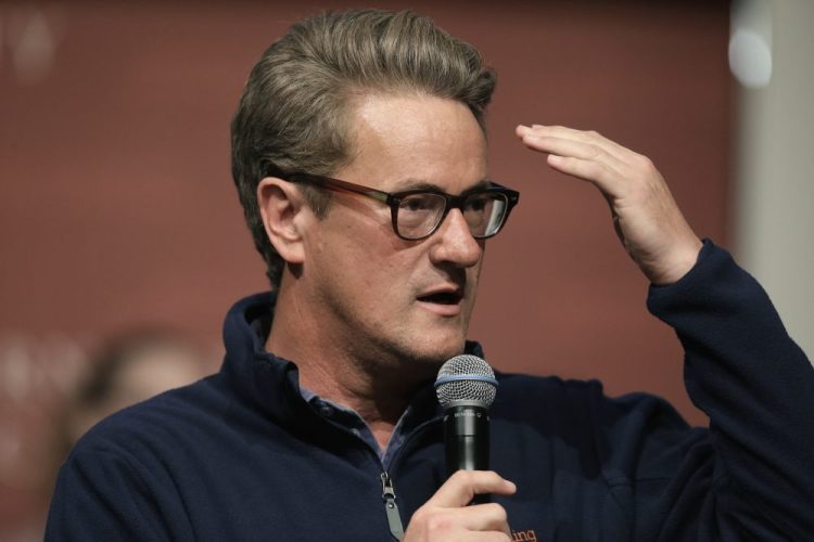 FILE - In this Oct. 11, 2017, file photo, MSNBC television anchor Joe Scarborough takes questions from an audience at a forum in 2017. The husband of a woman who died accidentally in an office of then-GOP Rep. Scarborough two decades ago is demanding that Twitter remove President Trump’s tweets suggesting Scarborough murdered her. 