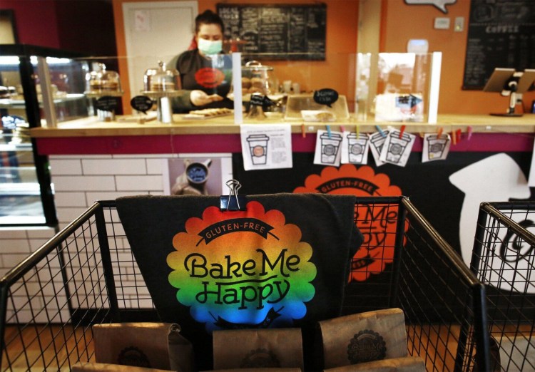 Nikole Meadows works behind the counter at Bake Me Happy, a gluten-free minority-owned bakery in Columbus, Ohio. As of April, the country lost nearly 450,000 active African American business owners as the pandemic intensified, according Robert Fairlie, an economics professor at the University of California at Santa Cruz. 