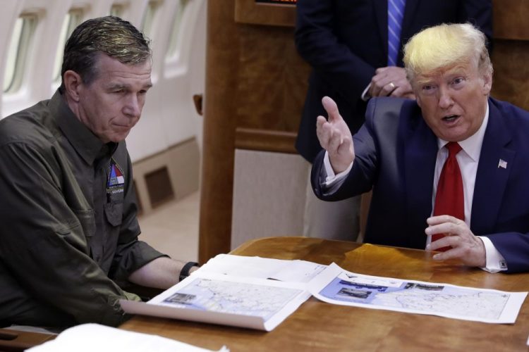 President Trump participates in a briefing about Hurricane Dorian with North Carolina Gov. Roy Cooper in 2019. Trump demanded Monday that Cooper sign off “immediately” on allowing the Republican National Convention to move forward in August with full attendance despite the pandemic.