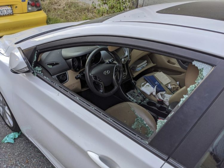 A parked car's driver side window was broken after a smash-and-grab break-in in Los Angeles. With more people than ever staying home to lessen the spread of COVID-19, their vehicles are parked unattended on the streets, making them easy targets.  