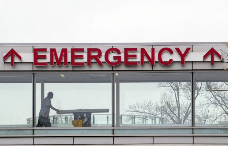 A medic moves a gurney April 20 at Queens Hospital Center in the Jamaica neighborhood of the Queens borough of New York.