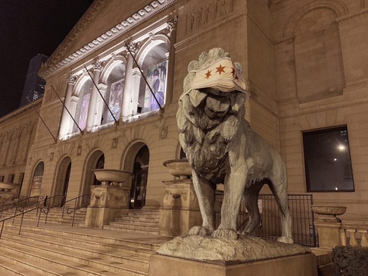 A lion statue with a mask Friday at the Art Institute of Chicago. A face mask adorning one of the iconic lion statues at the entrance of the Art Institute of Chicago was stolen Thursday, less than 24 hours after the symbolic masks were applied. By Friday afternoon, the mask had been replaced and both lion statues were once again sporting the protective gear.