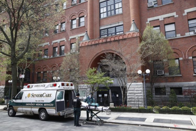 Emergency medical workers arrive at Cobble Hill Health Center in New York City last month. On Monday, New York City issued a bulletin warning doctors that they had found 15 children with a newly identified inflammatory syndrome that could be linked to COVID-19.