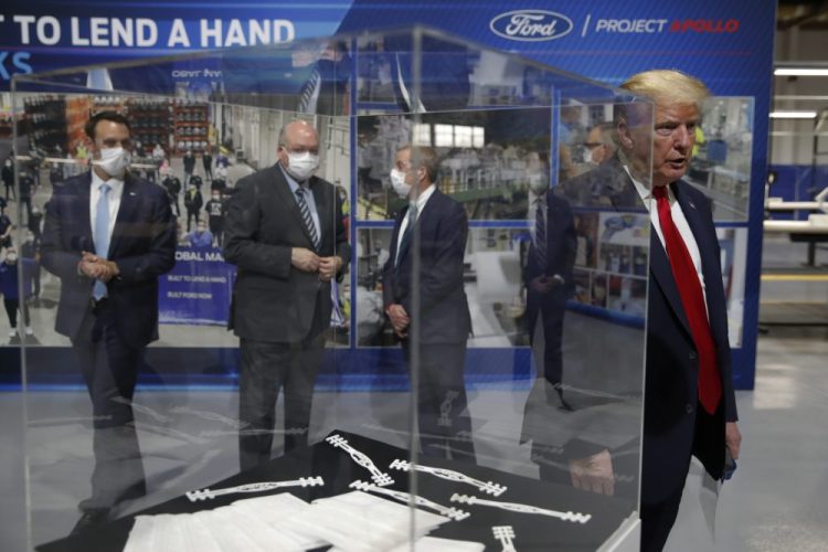 President Trump speaks as he tours Ford's Rawsonville Components Plant that has been converted to making personal protection and medical equipment on Thursday in Ypsilanti, Mich. 