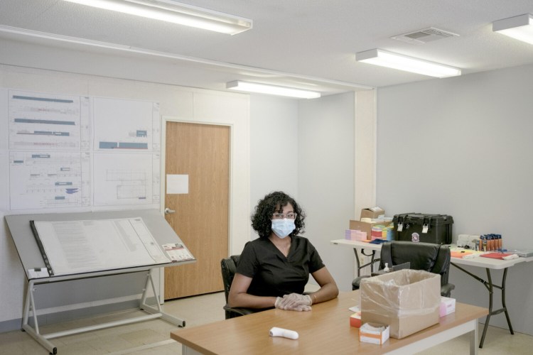 Simone Williams works as a thermal scanner in Urbana, Maryland. She helps screen about 100 construction workers for signs of the virus. She checks their temperature with a thermal scanner and asks questions about their health before clearing them to enter.  