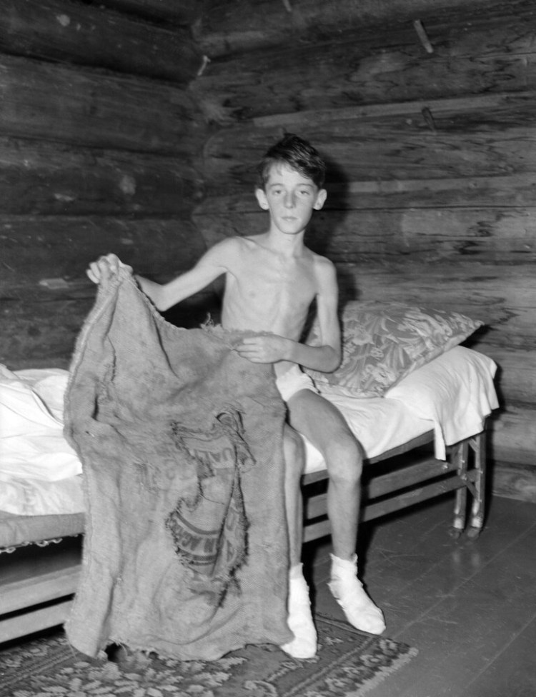 Donn Fendler shows the sack which he used as a sleeping bag while he wandered for eight days in the wilds of Maine in July 1939.   

