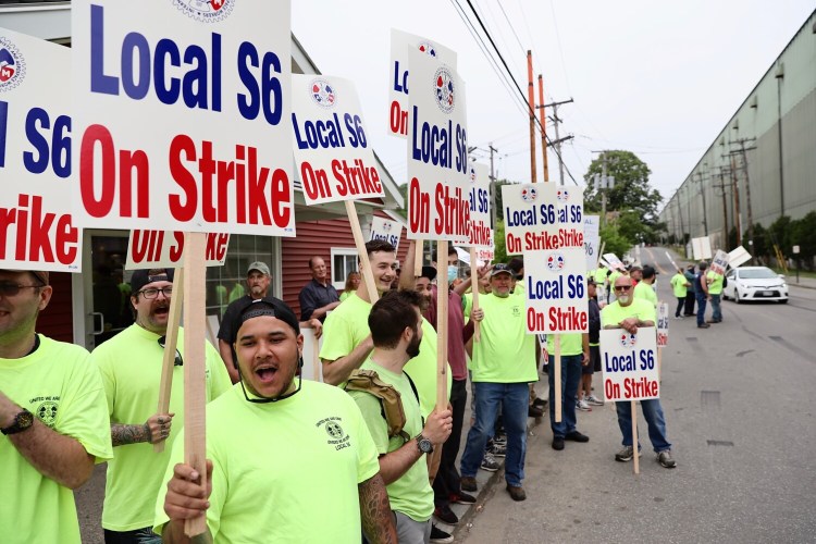 Members of Local S6 of the Machinists Union, which represents 4,300 of BIW’s 6,700 employees, march on strike Monday, June 22,in Bath. 
