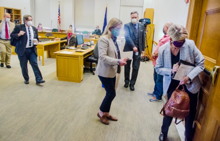 Rep. Donna Doore, D-Augusta, right, leads Labor and Housing Committee members out of the hearing room Thursday. Members expressed outrage that Labor Commissioner Laura Fortman was a no-show for the scheduled briefing.