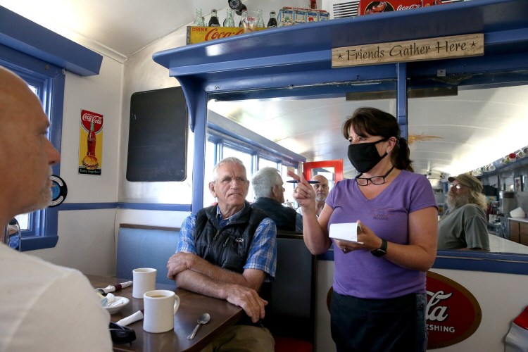 Margaret Murphy takes orders from regulars at the Brunswick Diner in this file photo from summer, 2020. Be patient with restaurant workers in the upcoming tourist season, say people in the industry, as there are not nearly enough workers to go around.