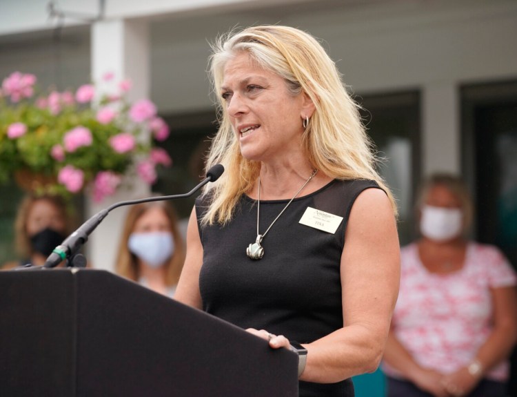 Tina Hewett-Gordon, general manager of the Nonantum Resort in Kennebunkport, speaks at a press conference in Ogunquit on Monday. Members of the Southern Maine Innkeepers Association held the press conference to decry the state’s restrictions on out-of-state visitors, which it said are causing significant cancellations and harming the lodging industry in Maine.