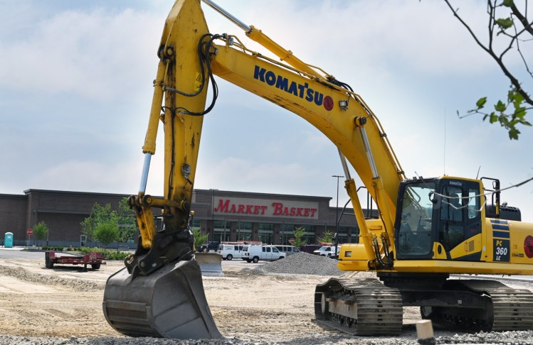 A backhoe at Rock Row sits near Market Basket in Westbrook Tuesday. The Massachusetts-based supermarket chain is hiring workers for its upcoming location, which will be its second in Maine.