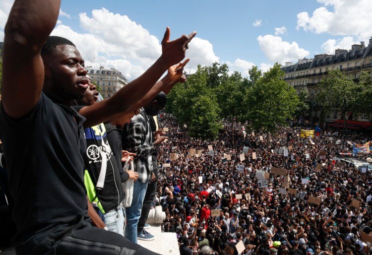 Thousands of people take part in a march against police brutality and racism in Paris on Saturday.