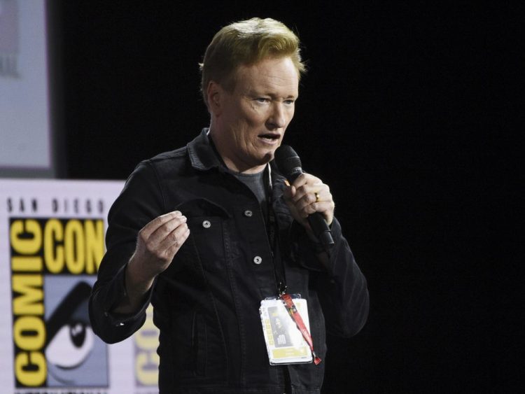 Conan O'Brien introduces Tom Cruise to present a clip from "Top Gun: Maverick" on day one of Comic-Con International in San Diego in June 2019. 