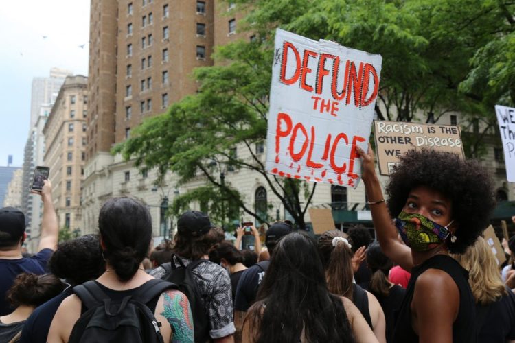 Protesters march Saturday in New York. Demonstrations continue across the United States in protest of racism and police brutality, sparked by the May 25 death of George Floyd in police custody in Minneapolis.