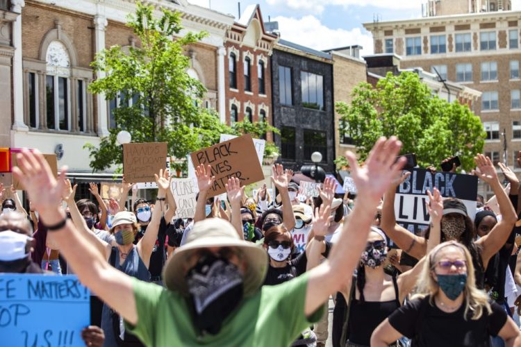 Protesters in Iowa City, Iowa, protest against police brutality and systemic racism on May 30.   