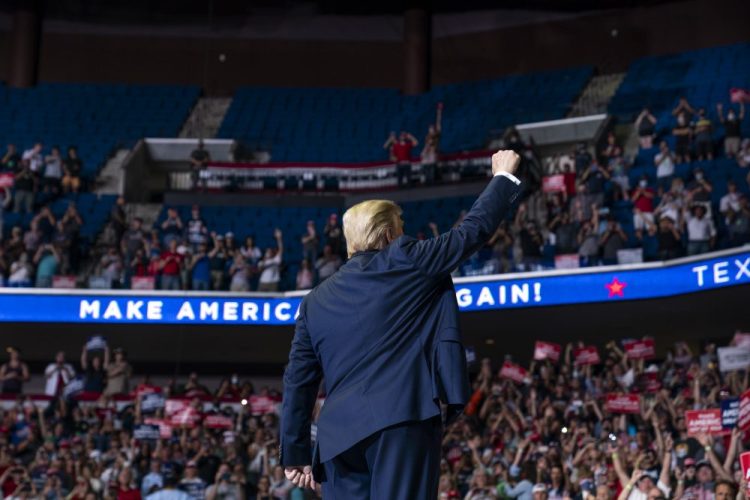 President Trump arrives at a campaign rally at the BOK Center on Saturday in Tulsa, Okla. The city's fire department spokesperson fire marshal’s office reported a crowd of just less than 6,200 in the arena after Tulsa officials had expected a crowd of 100,000.