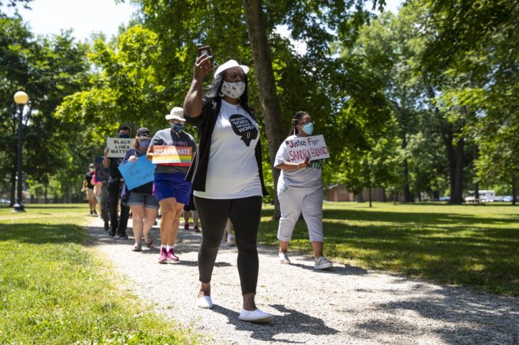 Jeannine Lee Lake, Democratic candidate for Indiana's 6th congressional district, leads a march June 19 to honor George Floyd during a Juneteenth event in Columbus, Ind.