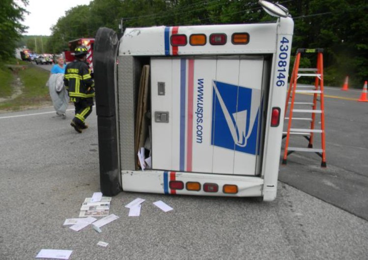 A U.S. postal truck on it's side after a collision in Cumberland County.

