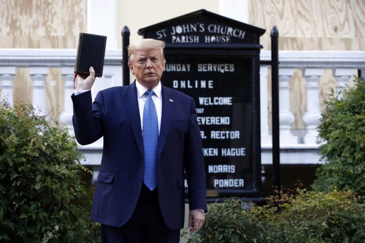 President Trump holds a Bible as he visits outside St. John's Church across Lafayette Park from the White House, June 1 in Washington.