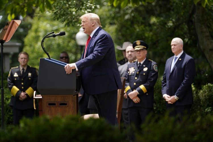 President Trump speaks during an event on police reform in the Rose Garden on Tuesday. Last week, the University of Washington’s Institute for Health Metrics and Evaluation published new projections that show COVID-19-related deaths in the U.S. could surpass 200,000 by Oct. 1.