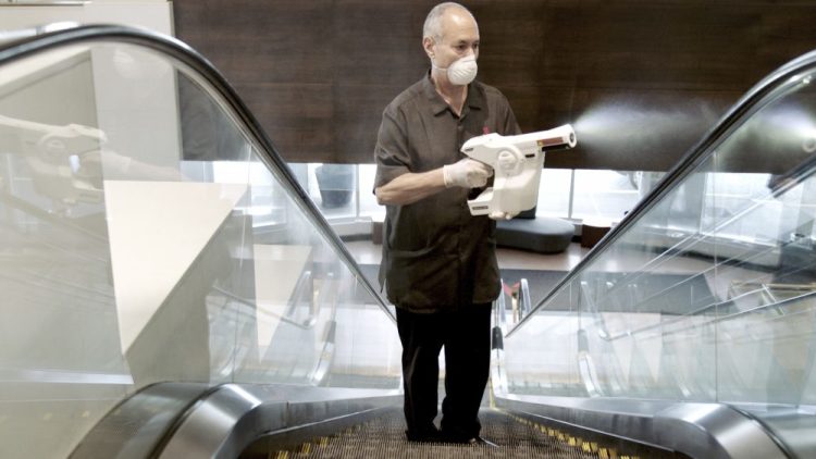 A Marriott associate uses an electrostatic sprayer to clean public areas at the Brooklyn Bridge Marriott in New York City. Hotels have made changes at every point. Inside the rooms, surfaces like TV remotes and light switches will get an extra cleaning. Best Western is getting rid of decorative pillows, pens and other unnecessary items. Once a room is cleaned and disinfected, Hilton will put a sticker on the door so guests know no one has been inside.