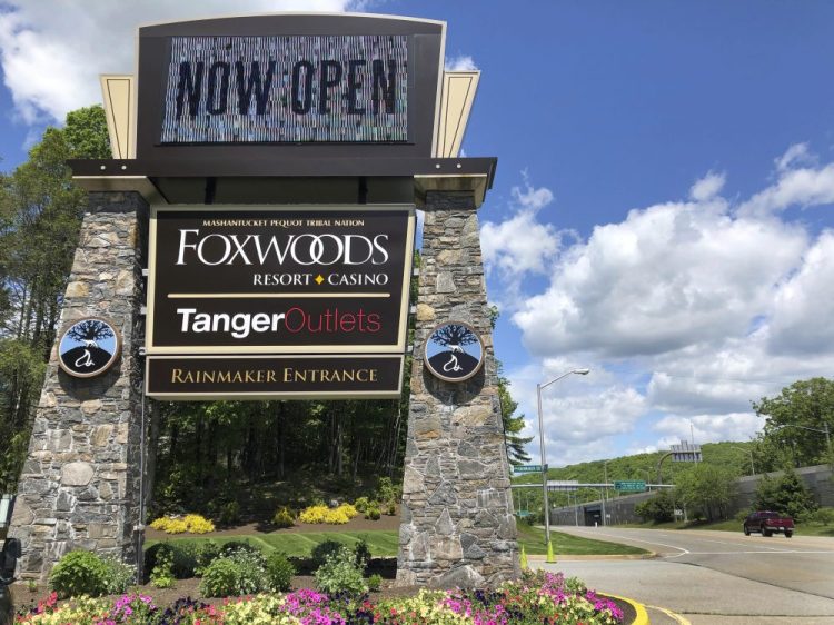 A sign at the entrance to the Foxwoods Resort Casino, in Mashantucket, Conn., announces its June 1 reopening. Both tribal casinos, Foxwoods and Mohegan Sun, closed since March 17, opened despite opposition from Gov. Ned Lamont, who has limited power regarding the sovereign nations. 