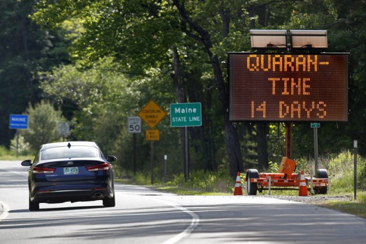 A sign in Gilead, Maine, near the border with New Hampshire, warns visitors entering Maine that they are required to quarantine for 14 days in June of 2020.