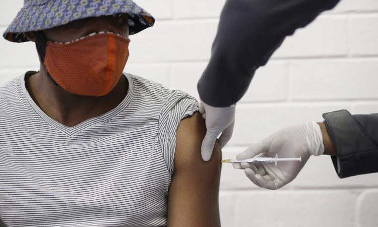 A volunteer receives a COVID-19 test vaccine developed at the University of Oxford in Britain, at the Chris Hani Baragwanath hospital in Johannesburg, South Africa, on Wednesday. The U.S. is set to open the largest trials – 30,000 people to test a government-created shot starting in July.