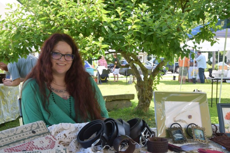 Katherine Devereux, here representing her business SPINNE Leather & Textiles, showcasing beautiful leather goods, oil and watercolor paintings, and home decor at the Belfast Farmers Market in 2019.
