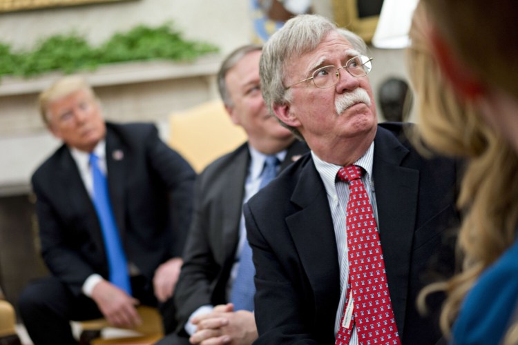 John Bolton, then national security adviser, listens during a Oct. 13, 2018, meeting in the Oval Office of the White House.