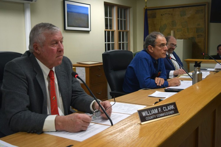 Hancock County Commissioners (from left) Bill Clark, Antonio Blasi and John Wombacher listen to testimony during a 2019 hearing. 