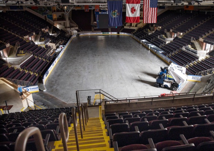 Operations manager Jim Leo at Cross Insurance Arena looks out on an empty floor on July 10 in Portland. Minor league sports franchises including the Maine Mariners, which play at the arena, are in a holding pattern until games can resume safely.